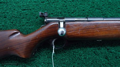 This old rifle shows lots of bluing wear with the barrel and receiver showing lots of silver. . Wards western field 22lr